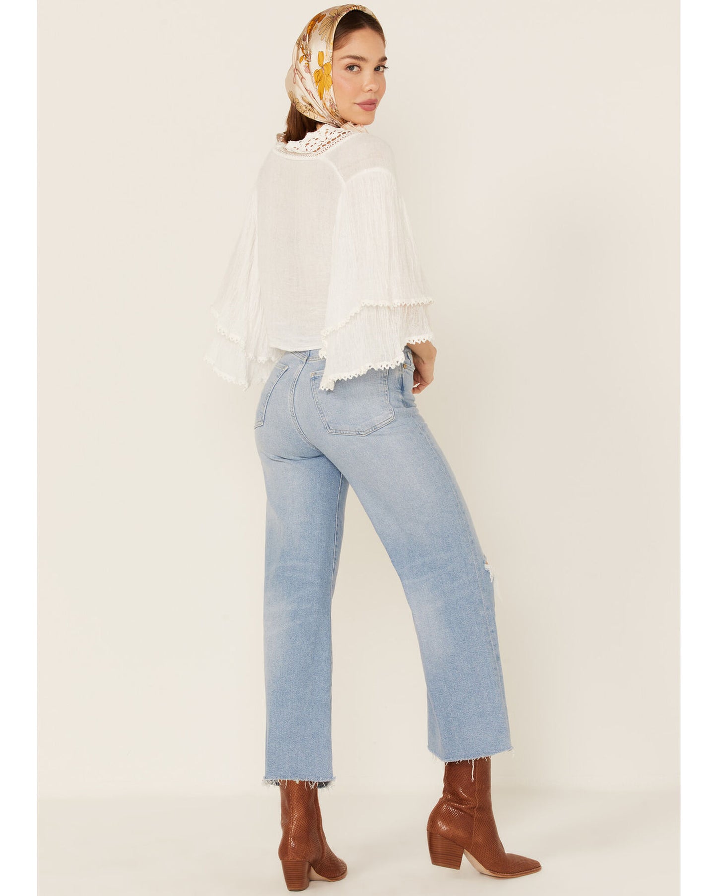 Back picture of a model wearing the 7 For All Mankind Women's Luxe Vintage Cropped Jo Trouser Flare Jeans - CT Grace