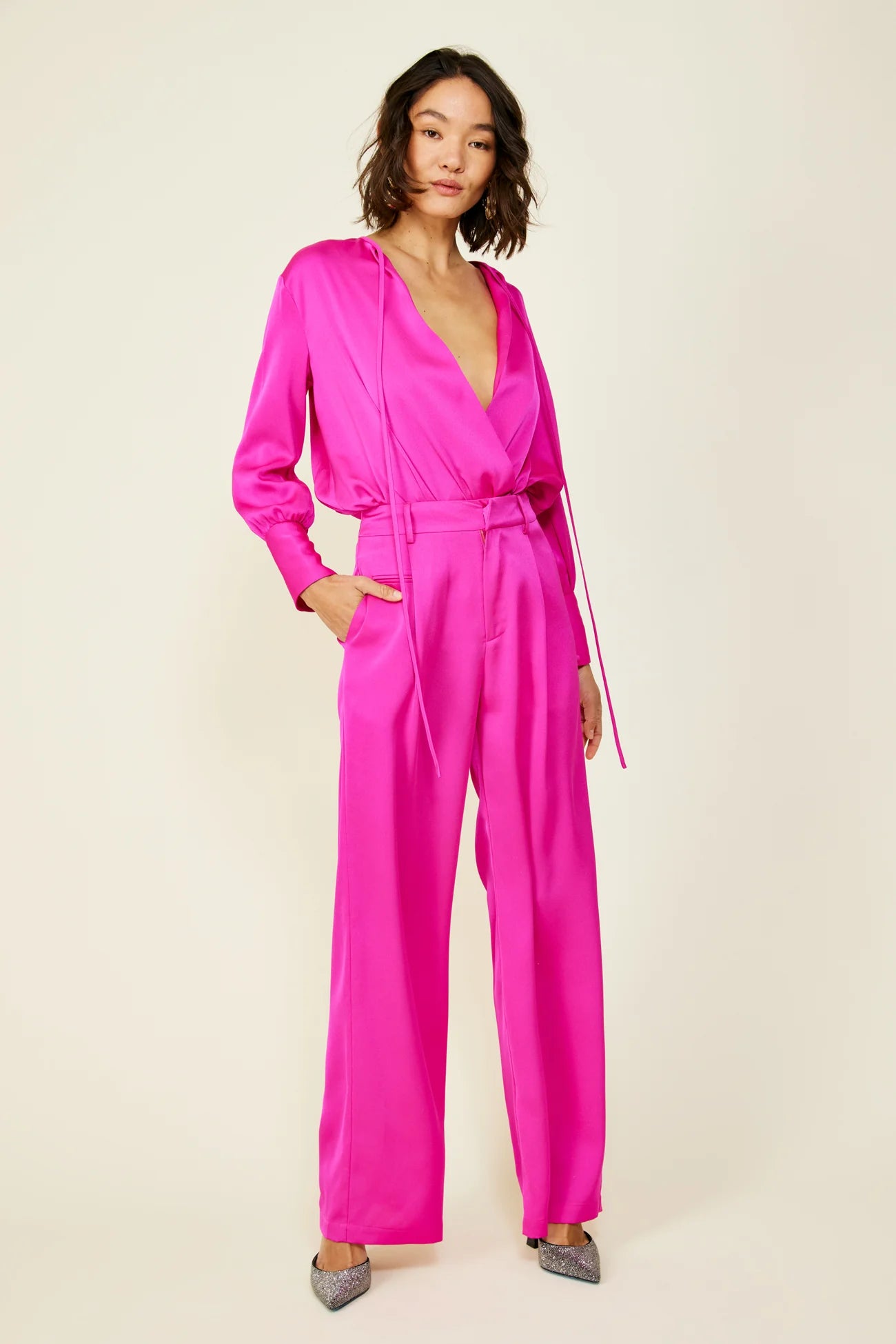 Picture of a brunette model using the Line & Dot Magenta Body Suit - CT Grace