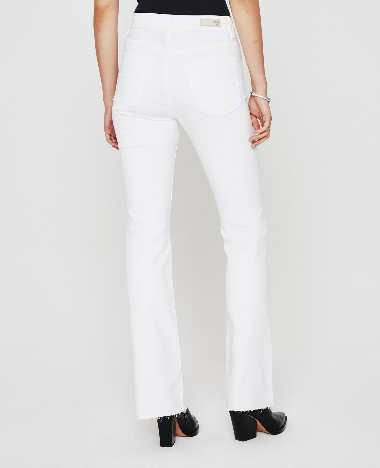 Back picture of a model wearing the AG Jeans White Alexxis Boot - CT Grace