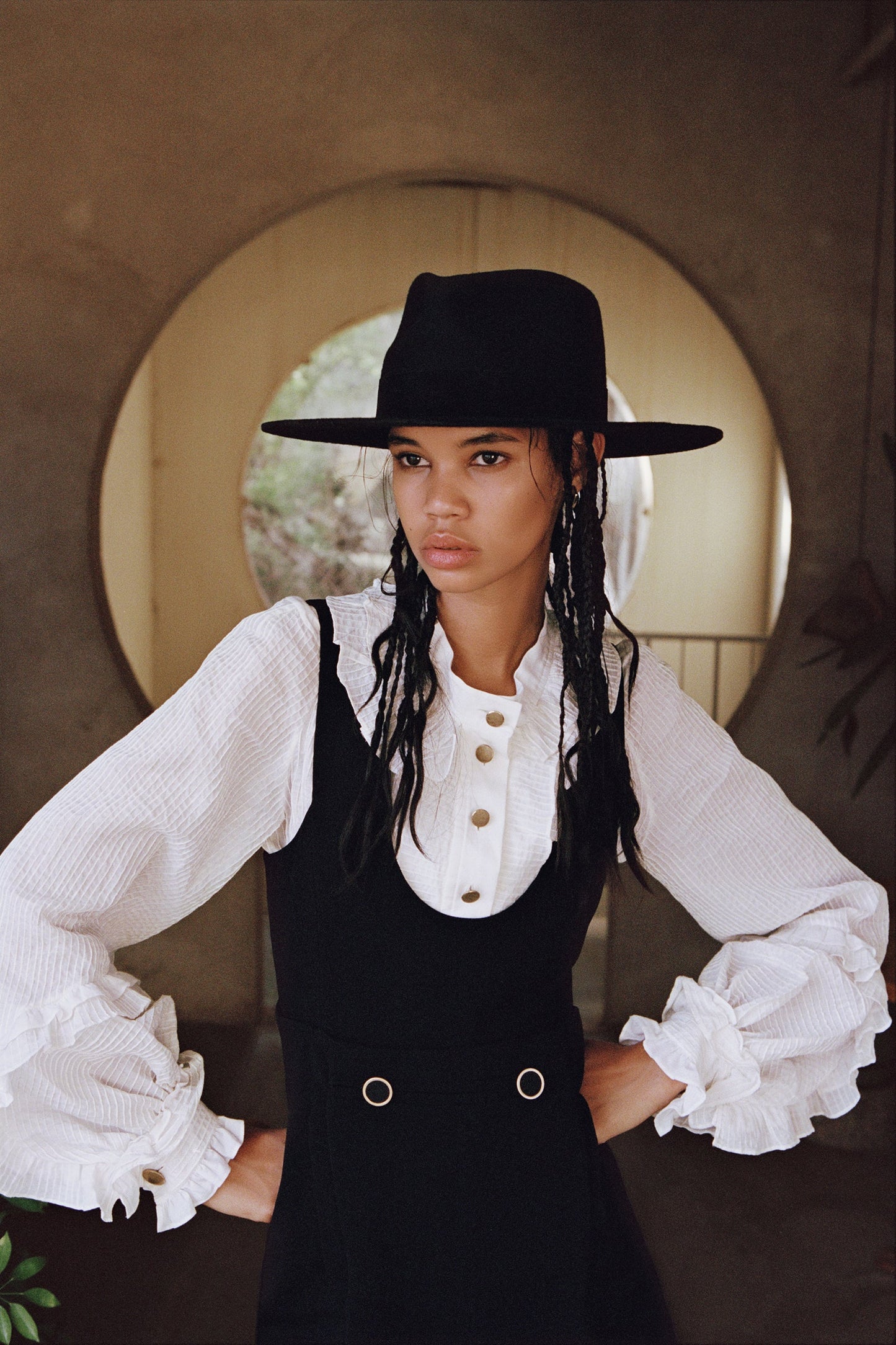 Picture of a model wearing the Lack of Color Black Mirage Hat - CT Grace