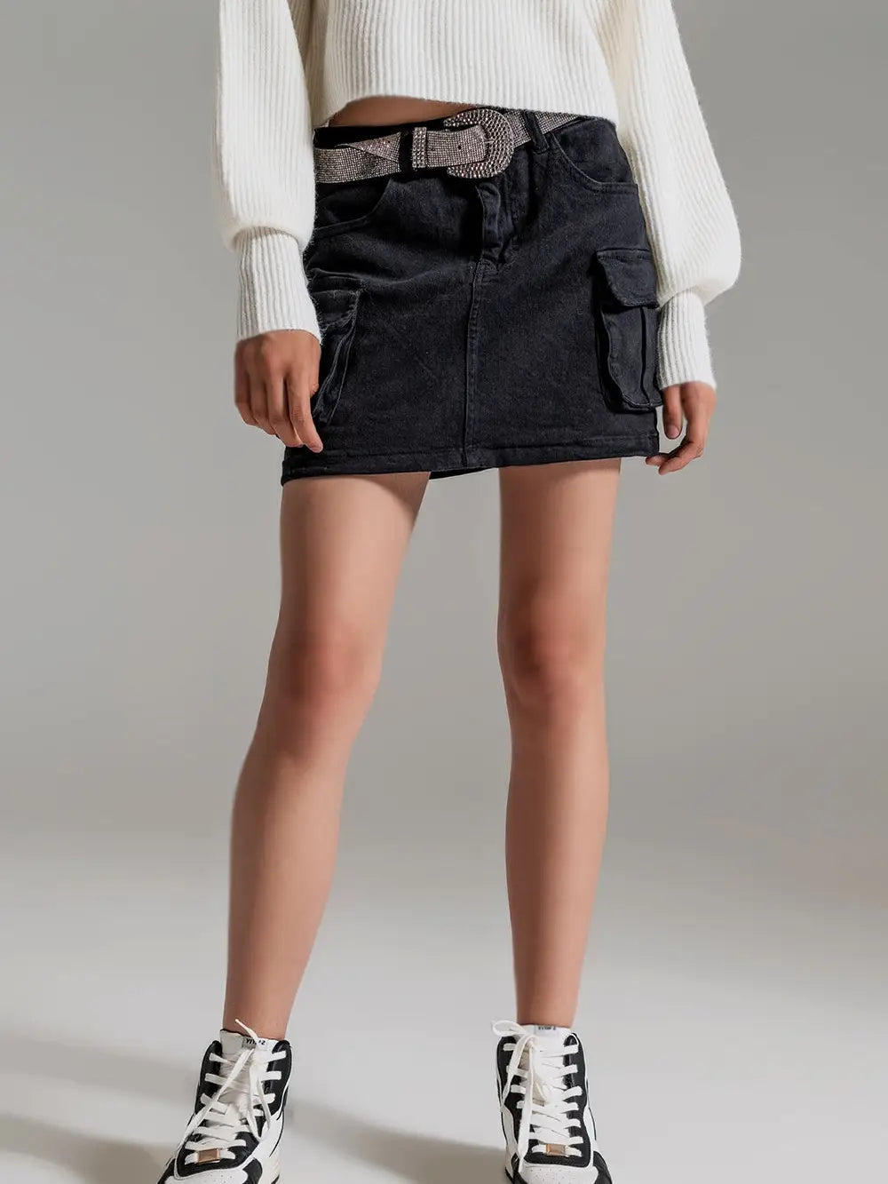 Picture of a model wearing the Q2 Black Cargo Mini - CT Grace