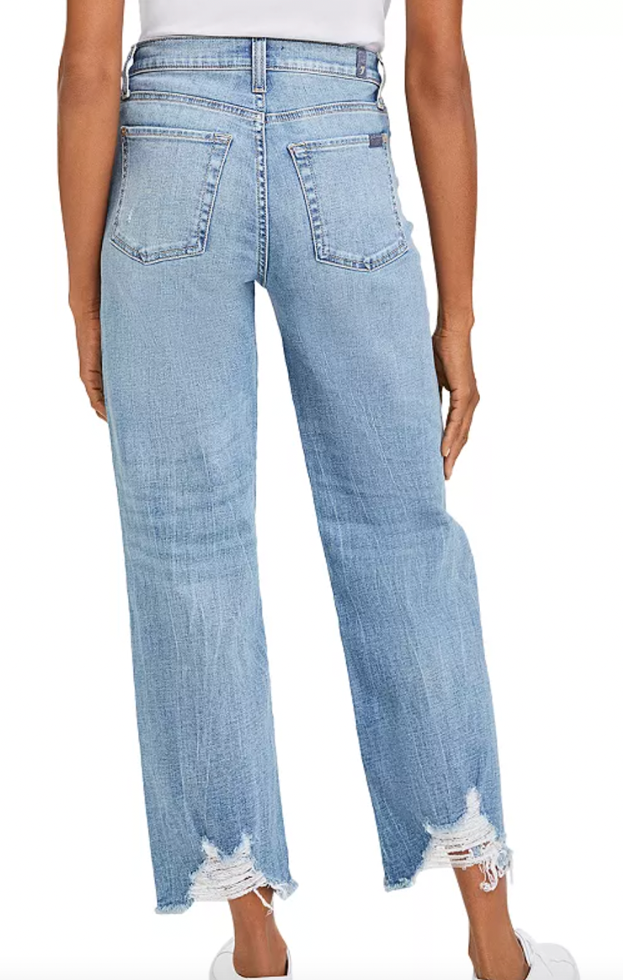 Back picture of a model wearing the 7 For All Mankind Cropped Alexa Wide-Leg Jeans in Lovechild - CT Grace
