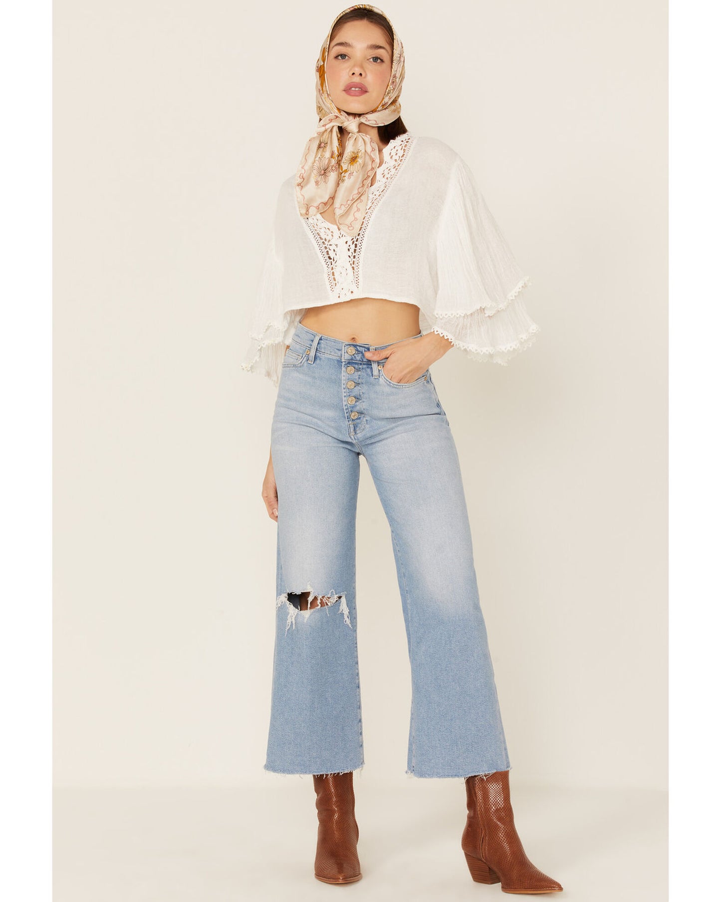 Front picture of a model wearing the 7 For All Mankind Women's Luxe Vintage Cropped Jo Trouser Flare Jeans - CT Grace