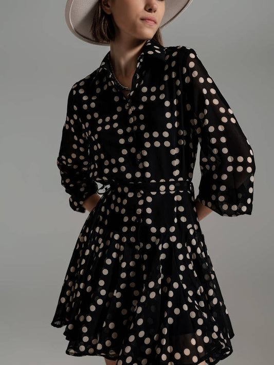 Picture of a model wearing the Q2 Fit and Frill Polka Dot Dress with Voluminous Sleeves in Black - CT Grace