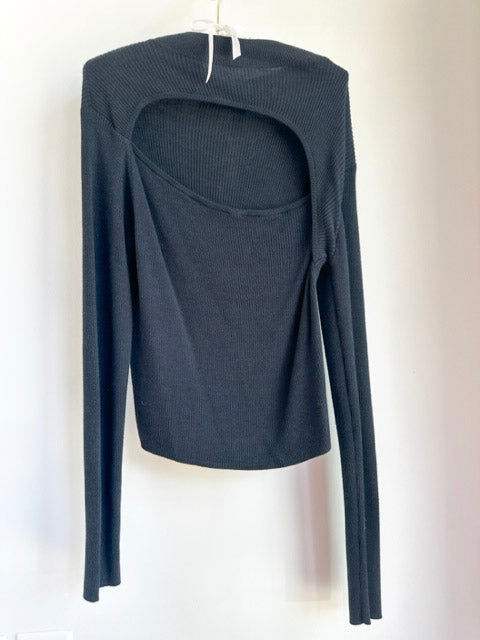Picture of the Sanctuary Cutout Sweater Black hanging on a clothes hanger over a white background- CT Grace