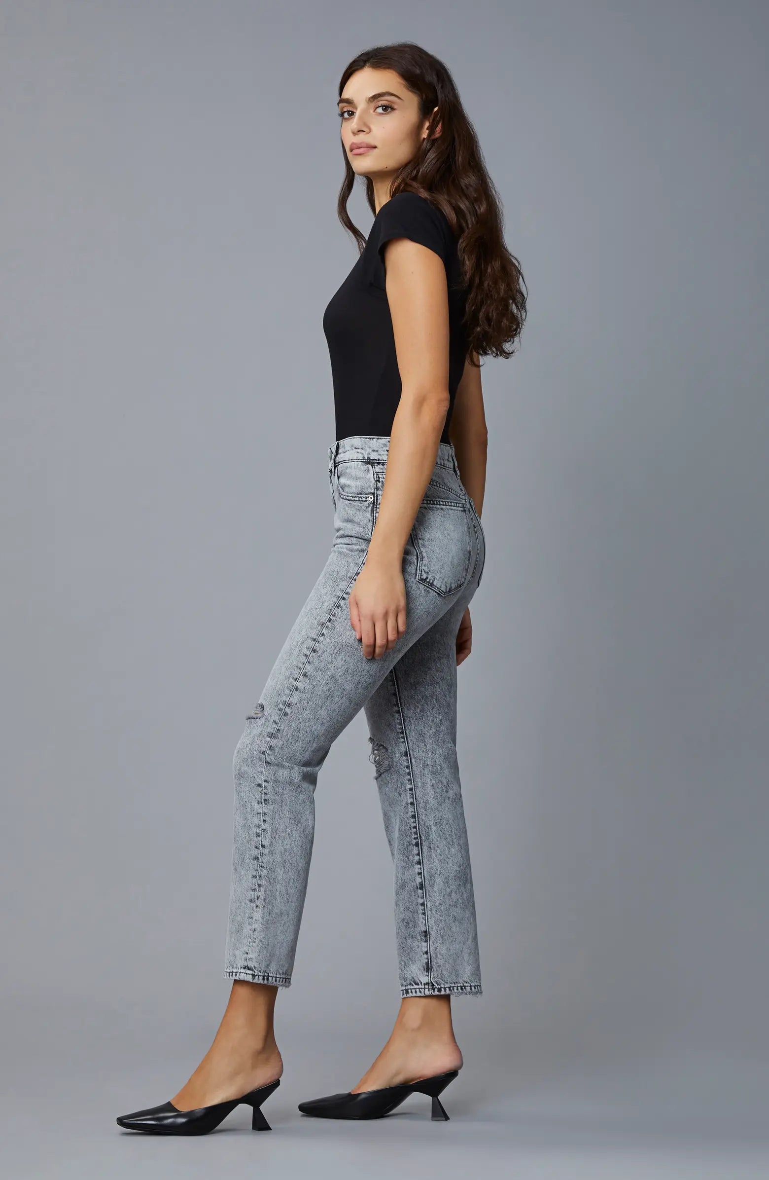 Side Picture of a model wearing the DL1961 Patti Straight High Rise Vintage Ankle-Chalk Distressed - CT Grace