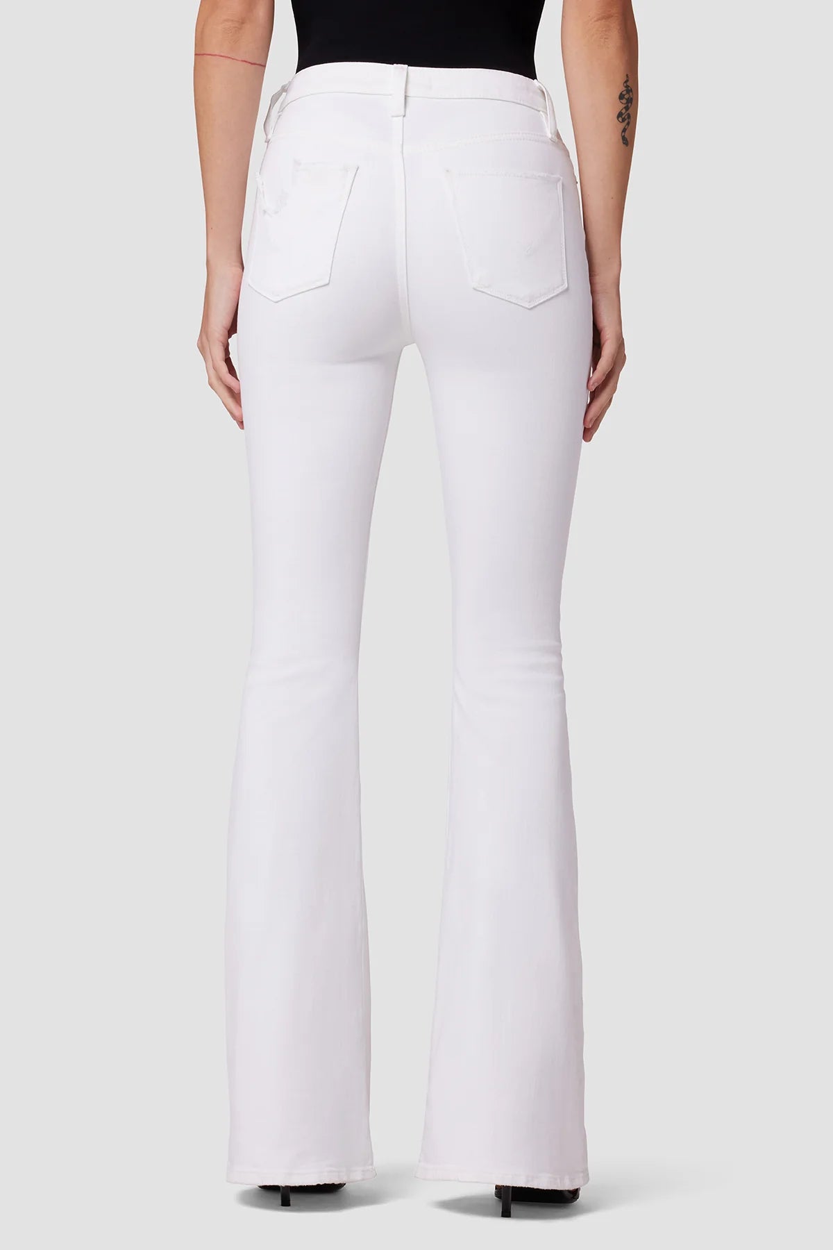 Back picture of a model wearing the Hudson Holly High Rise Flare Flap - White - CT Grace