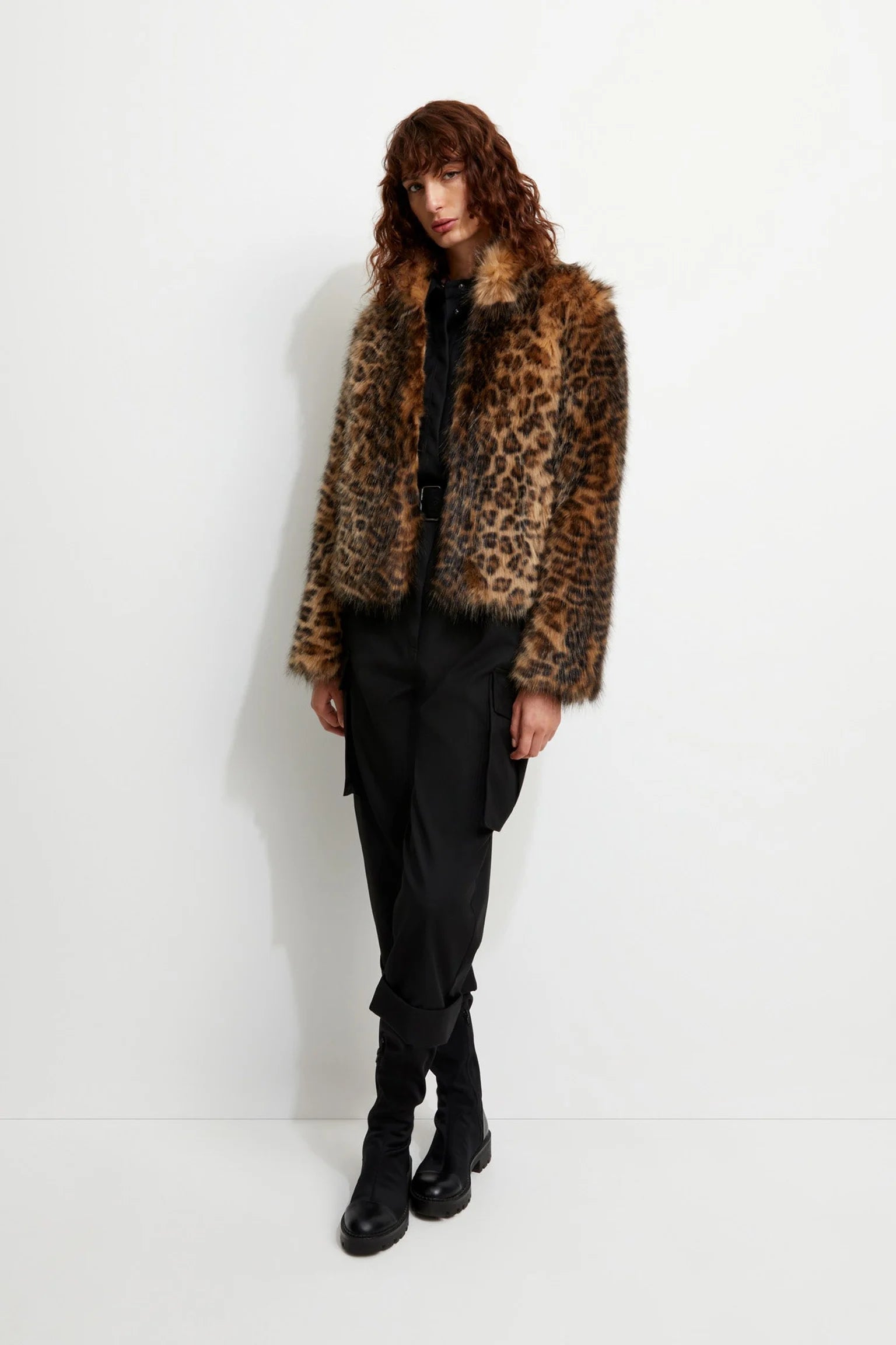 Picture of a model wearing the Unreal Fur Short Cheetah Fur Coat - CT Grace