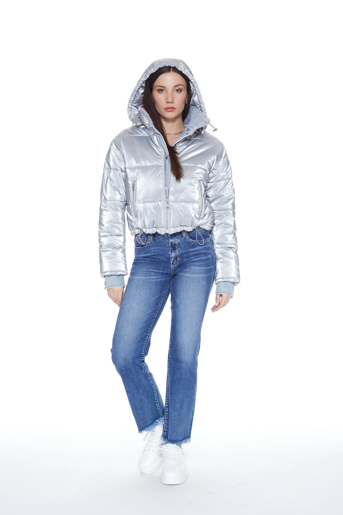 Front picture of a model wearing the Blue Revival In the Mix Sliver Denim Puffer with the hood on- CT Grace