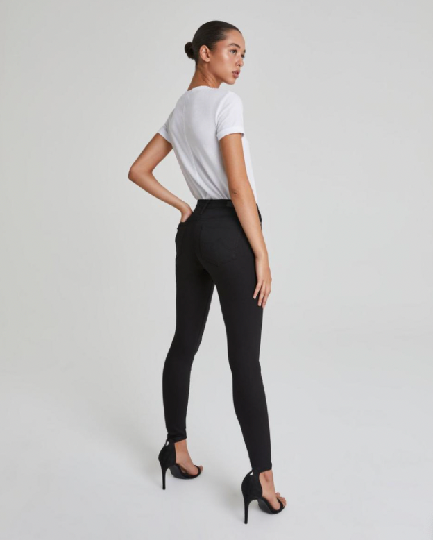 Back picture of a model wearing AG Black Farrah Seamless Ankle Jeans - Super Black - CT Grace